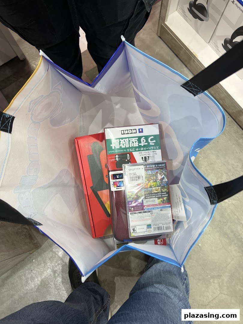 A shopping bag filled with newly purchased Nintendo Switch games and accessories.
