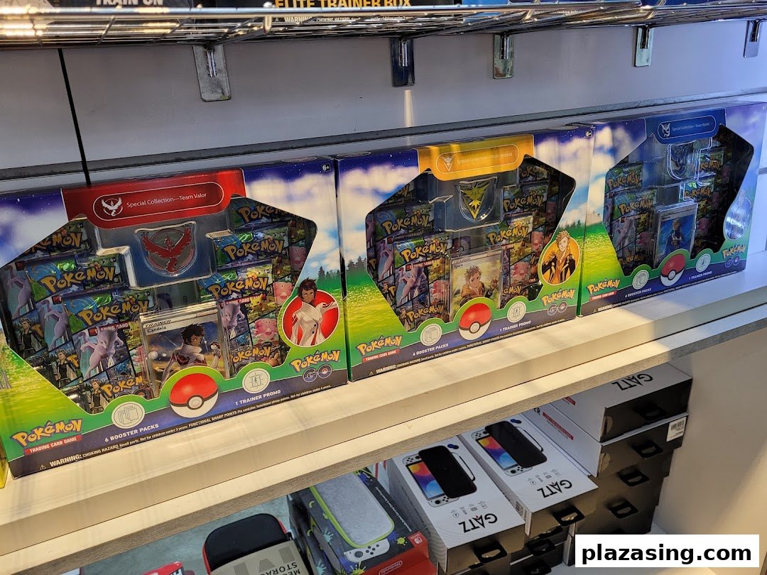 Pokemon TCG special collection boxes and gaming accessories displayed on shelves.