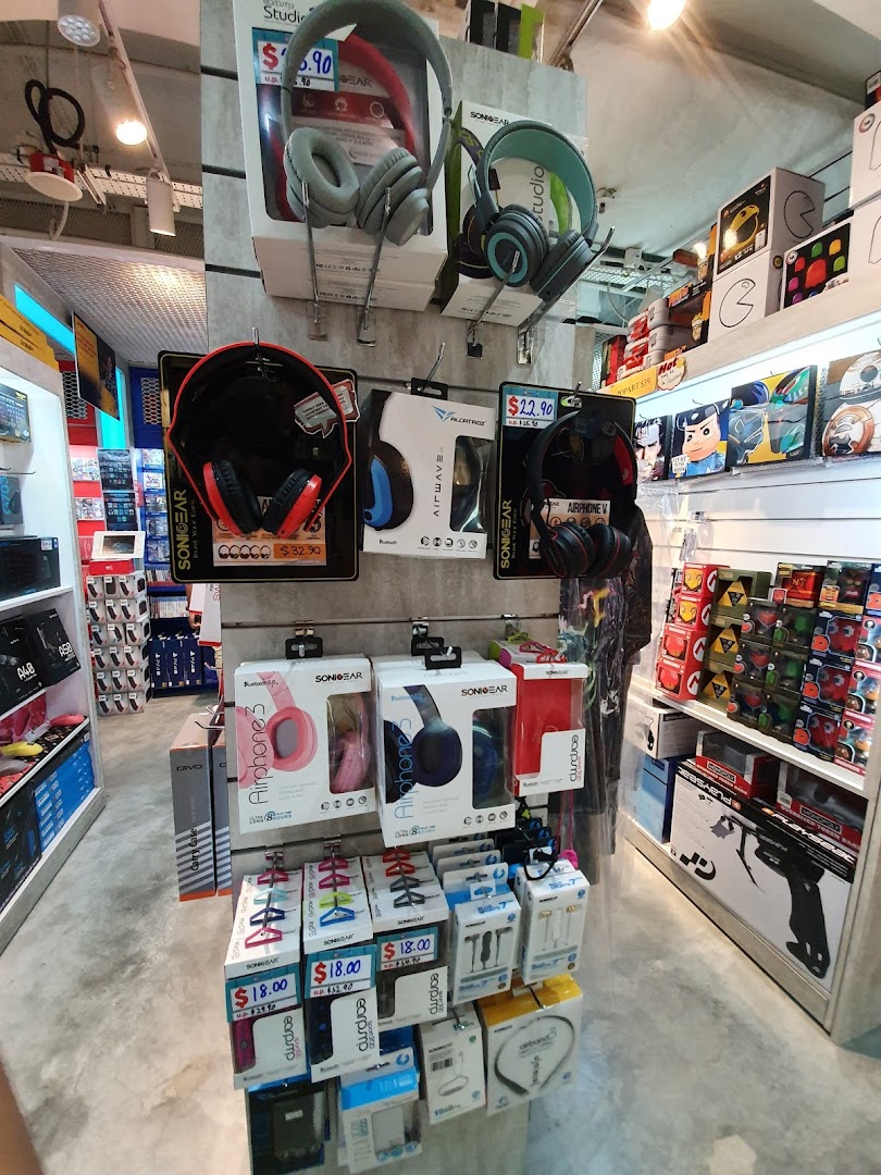 An interior view of GameMartz Plaza Sing, showcasing a wide array of headphones and audio accessories.