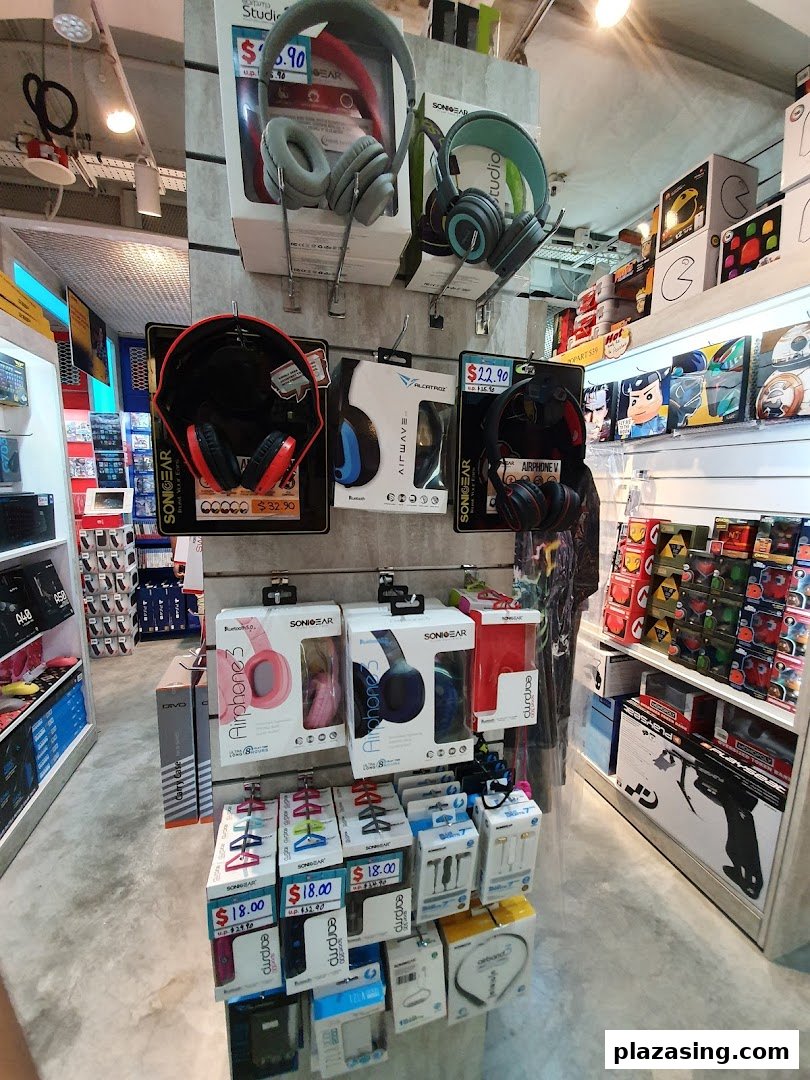 An interior view of GameMartz Plaza Sing, showcasing a wide array of headphones and audio accessories.
