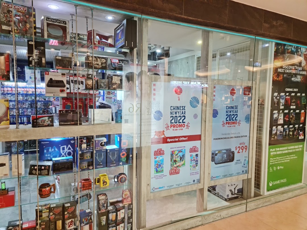 The storefront of GameMartz Plaza Sing, showcasing gaming consoles, accessories, and Chinese New Year promotions.