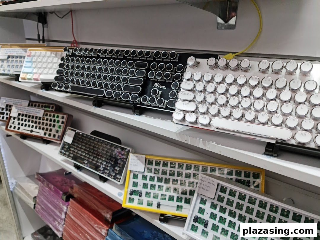 A vibrant display of various mechanical keyboards and components on shelves at GameMartz.