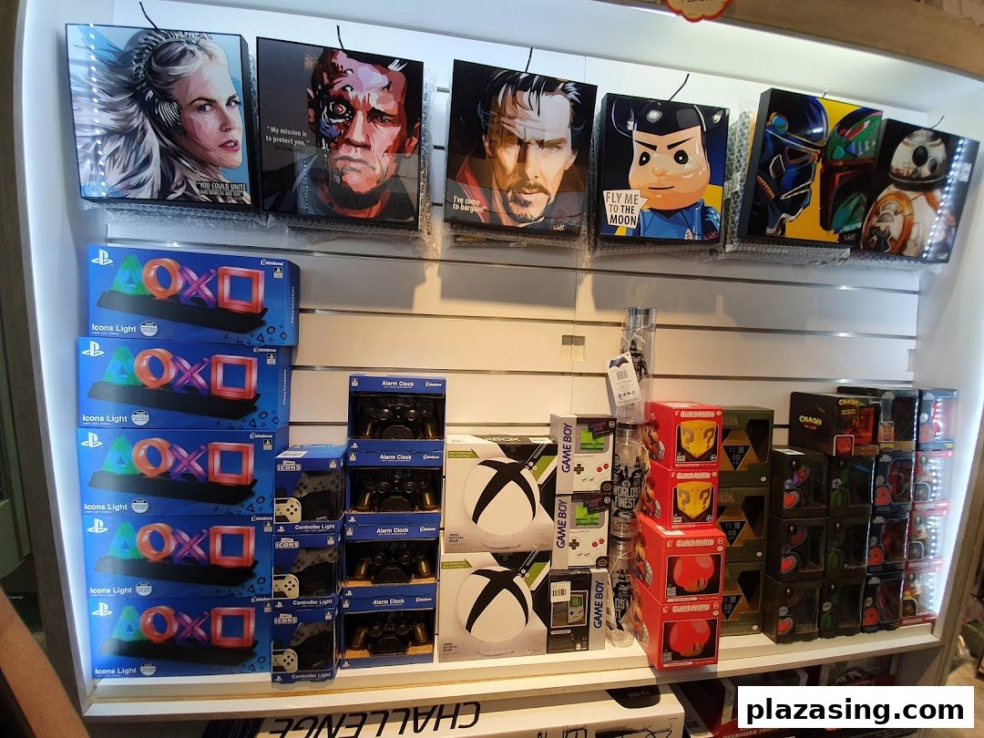 A display of gaming merchandise, pop culture collectibles, and novelty items like PlayStation Icons Lights and character art.