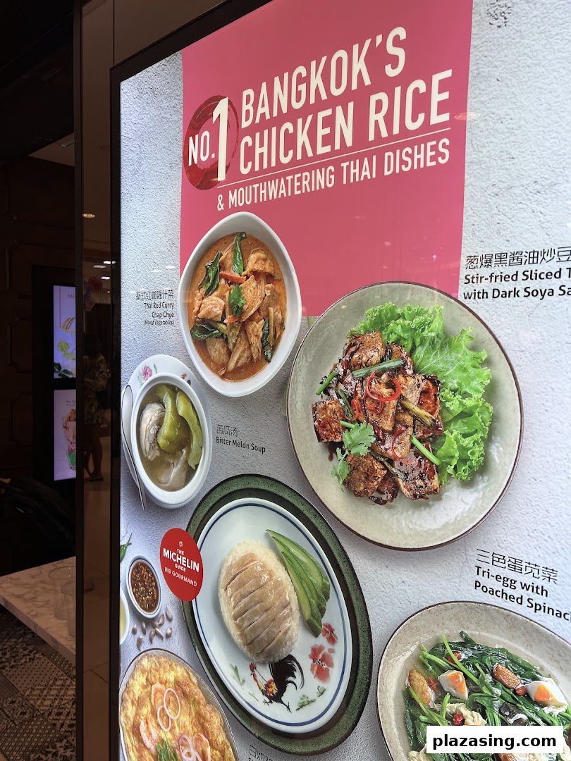 A vibrant display showcasing Go-Ang Pratunam's signature chicken rice and other mouthwatering Thai dishes.