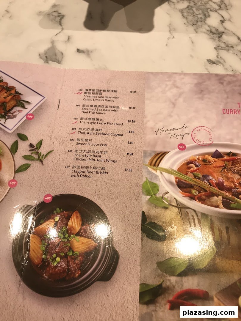 A detailed menu page showcasing a variety of Thai-style seafood, fish, and meat dishes.