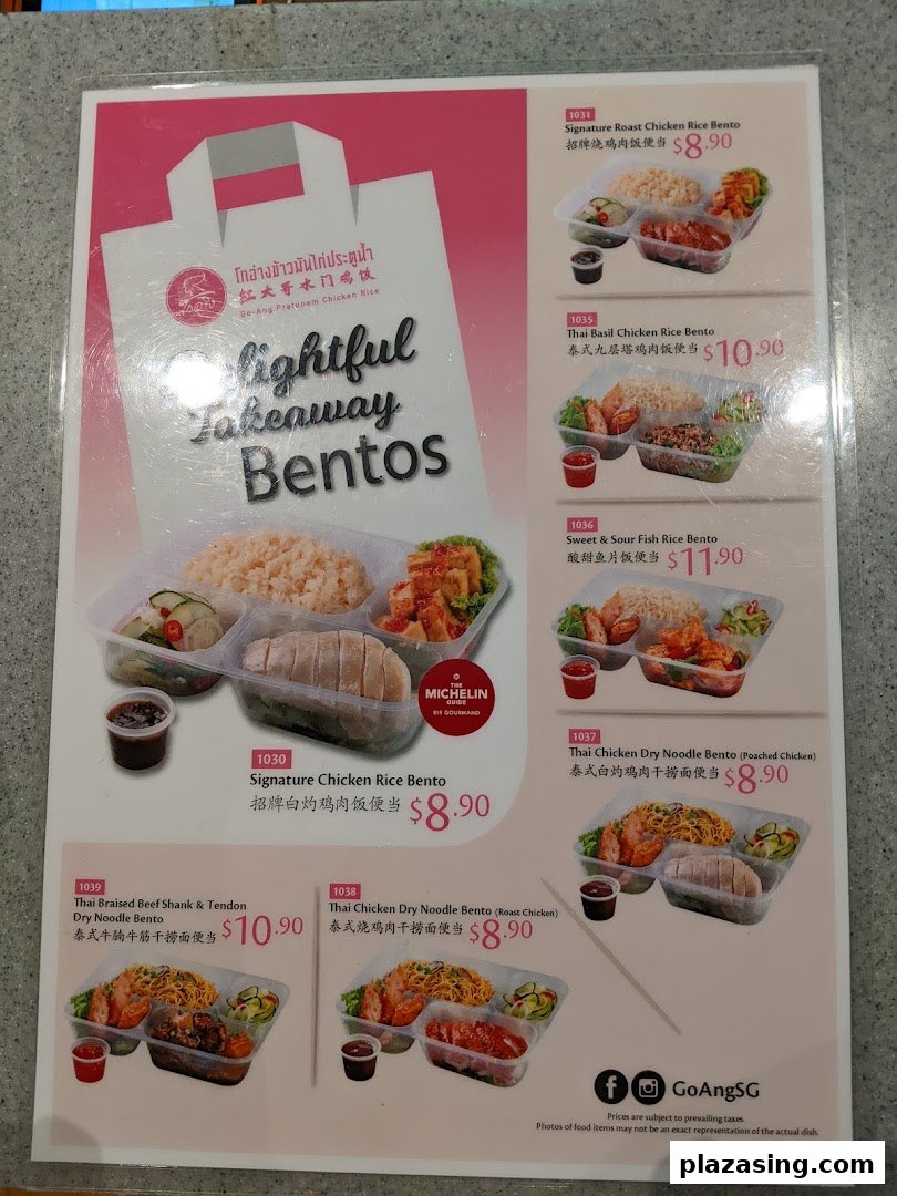 A menu board showcasing Go-Ang Pratunam Chicken Rice's variety of takeaway bento sets with prices.