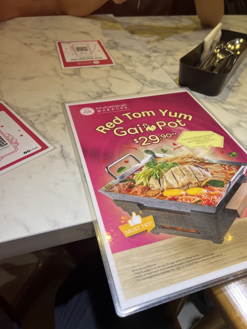 A vibrant menu display featuring the 'Red Tom Yum Gai Pot' with its price and ingredients.