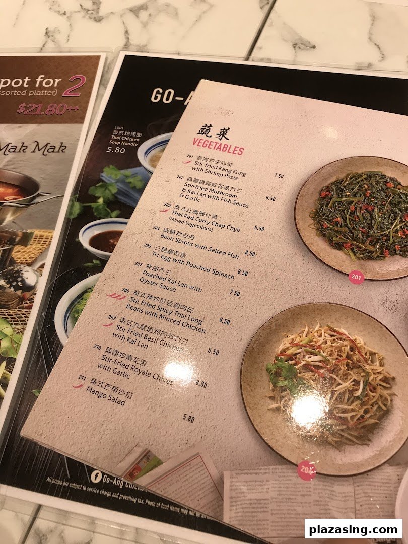 A close-up view of a menu page featuring a variety of vegetable dishes and their prices.