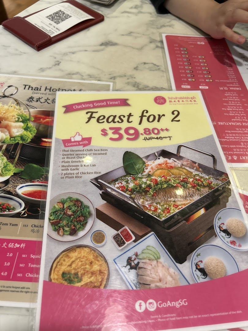 A menu display featuring the 'Feast for 2' set meal with various Thai dishes and other menu sections.