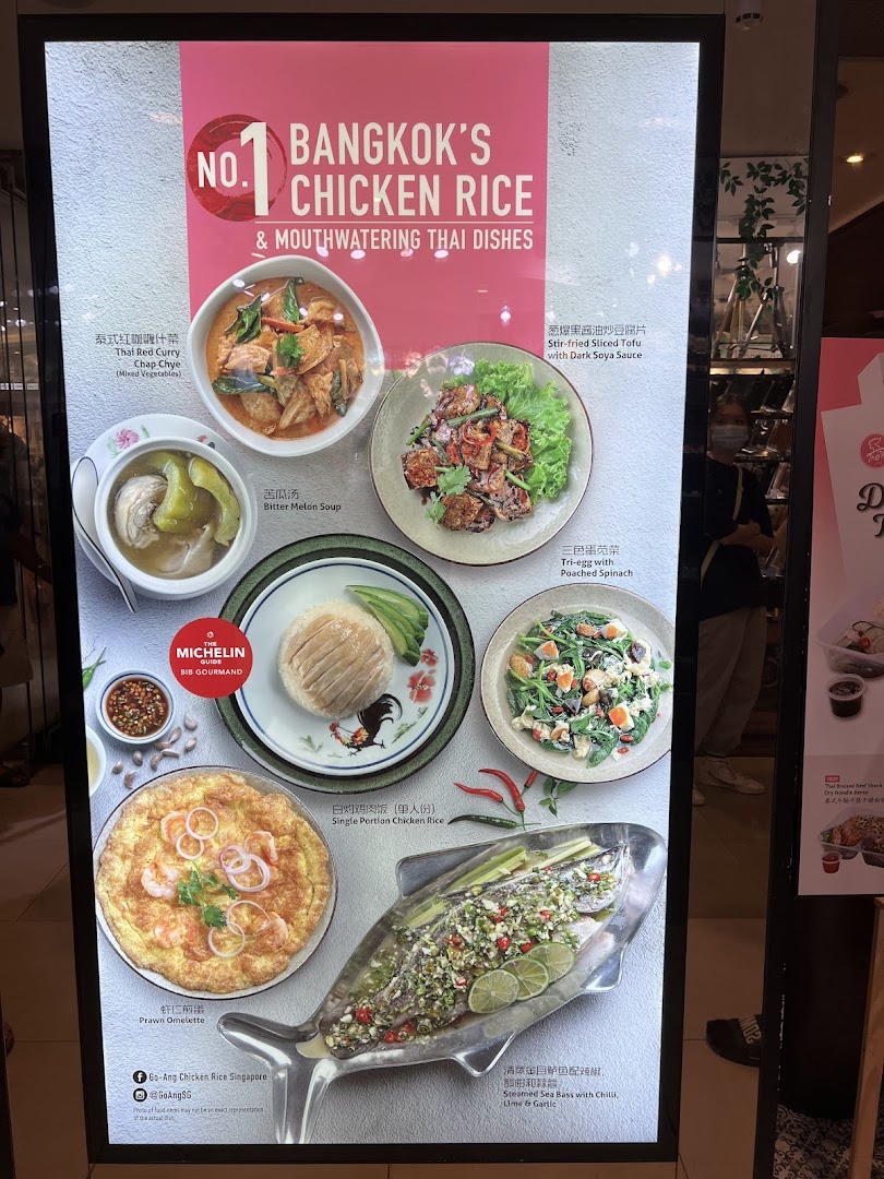 A vibrant display board showcasing Go-Ang Pratunam Chicken Rice's signature Thai dishes and chicken rice.