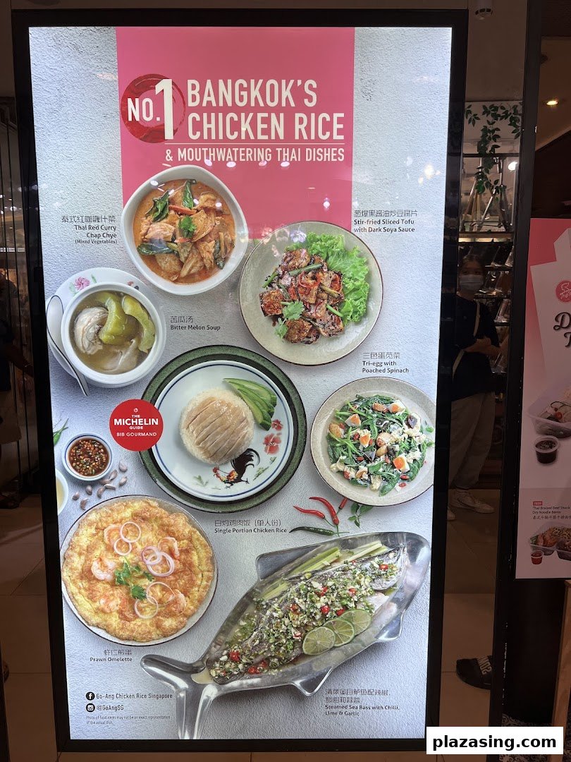 A vibrant display board showcasing Go-Ang Pratunam Chicken Rice's signature Thai dishes and chicken rice.