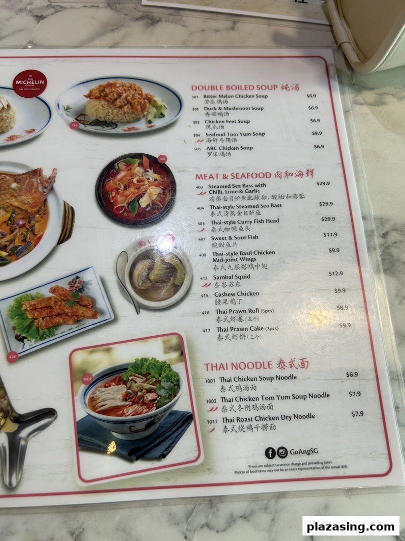 A detailed menu page from Go-Ang Pratunam Chicken Rice, featuring soups, seafood, and noodles.