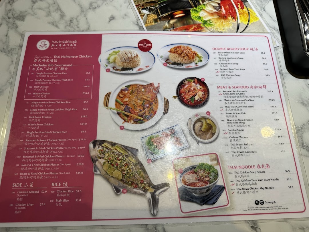 A detailed menu from Go-Ang Pratunam Chicken Rice, featuring Thai Hainanese chicken, soups, seafood, and noodles.