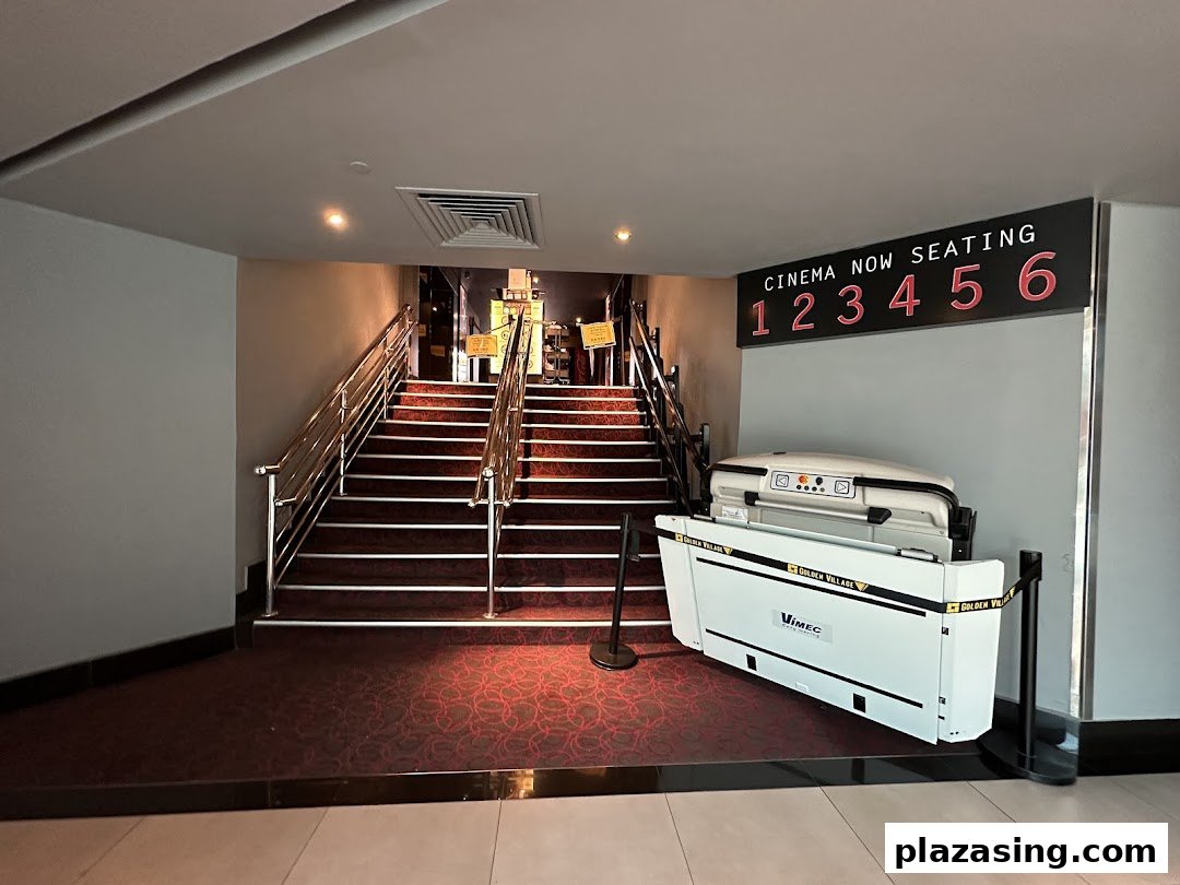 Entrance to cinema halls with stairs and accessibility lift, showing seating information for Golden Village Plaza.
