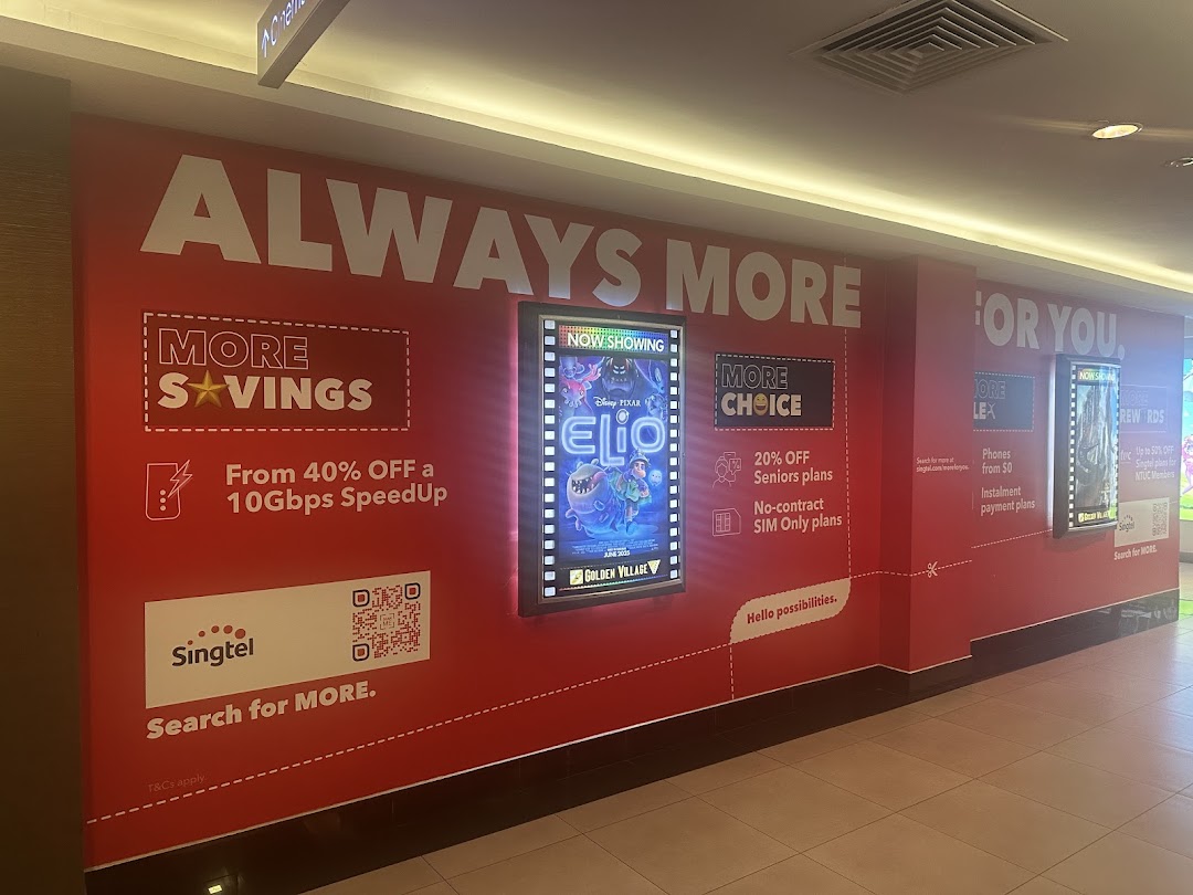 A vibrant red wall featuring Singtel advertisements for mobile and internet plans, alongside movie posters.