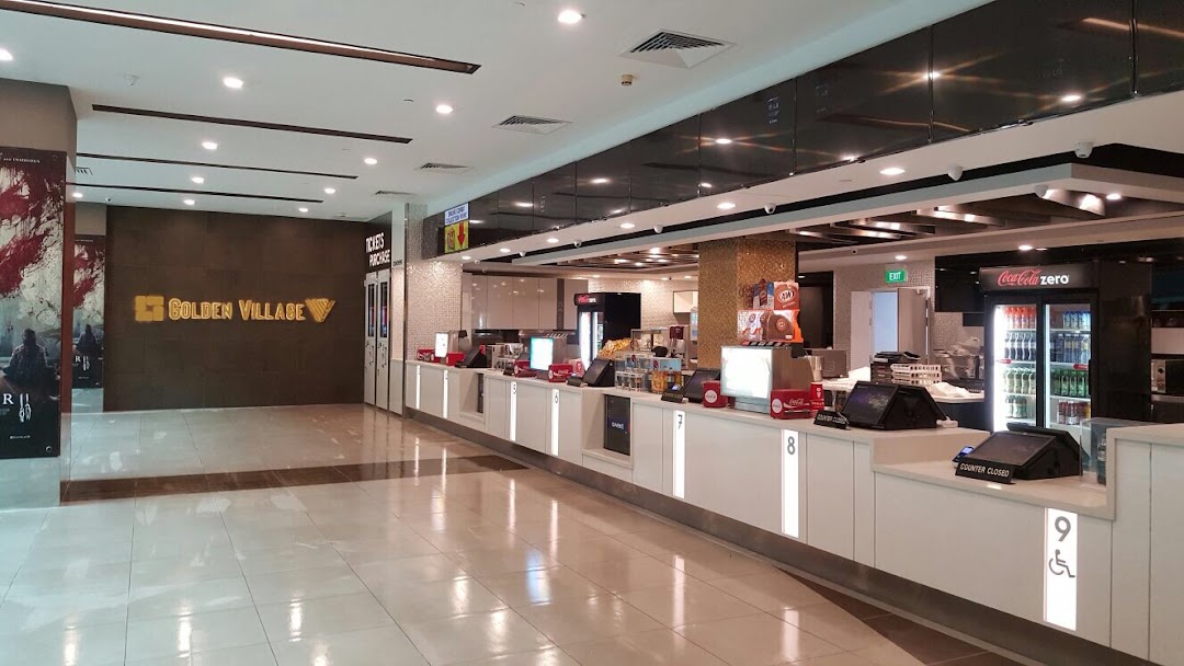 Interior view of Golden Village Plaza cinema lobby with ticket and concession counters.