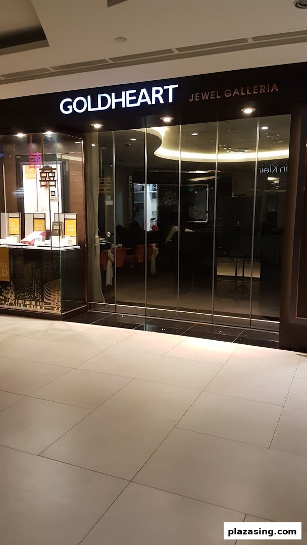 The illuminated storefront of Goldheart Jewel Galleria, showcasing its elegant entrance and display.