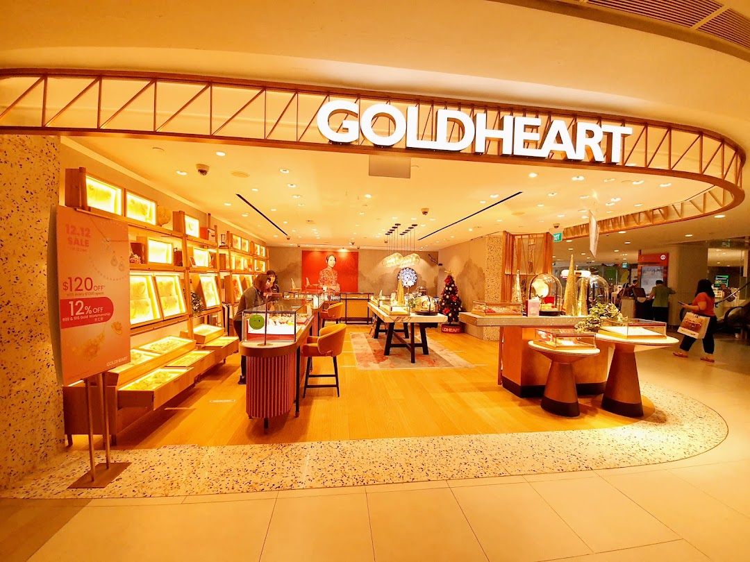 The brightly lit entrance of Goldheart Jewelry at Plaza Singapura, showcasing elegant displays and a welcoming interior.