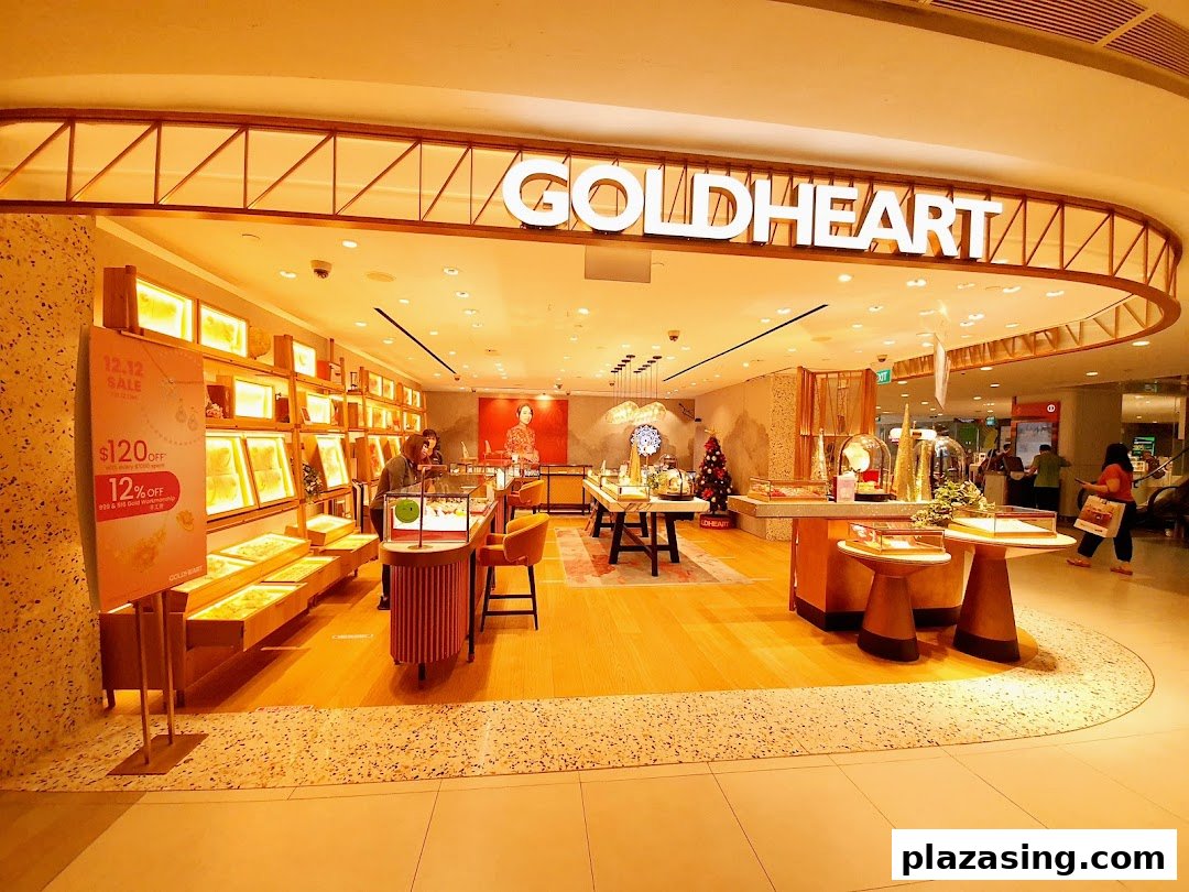 The brightly lit entrance of Goldheart Jewelry at Plaza Singapura, showcasing elegant displays and a welcoming interior.
