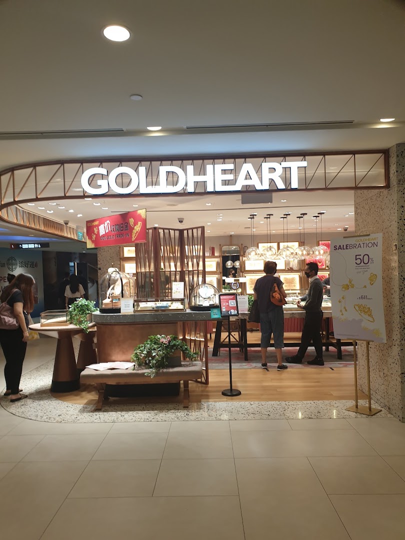 The Goldheart Jewelry shop front with customers browsing displays and promotional signage.