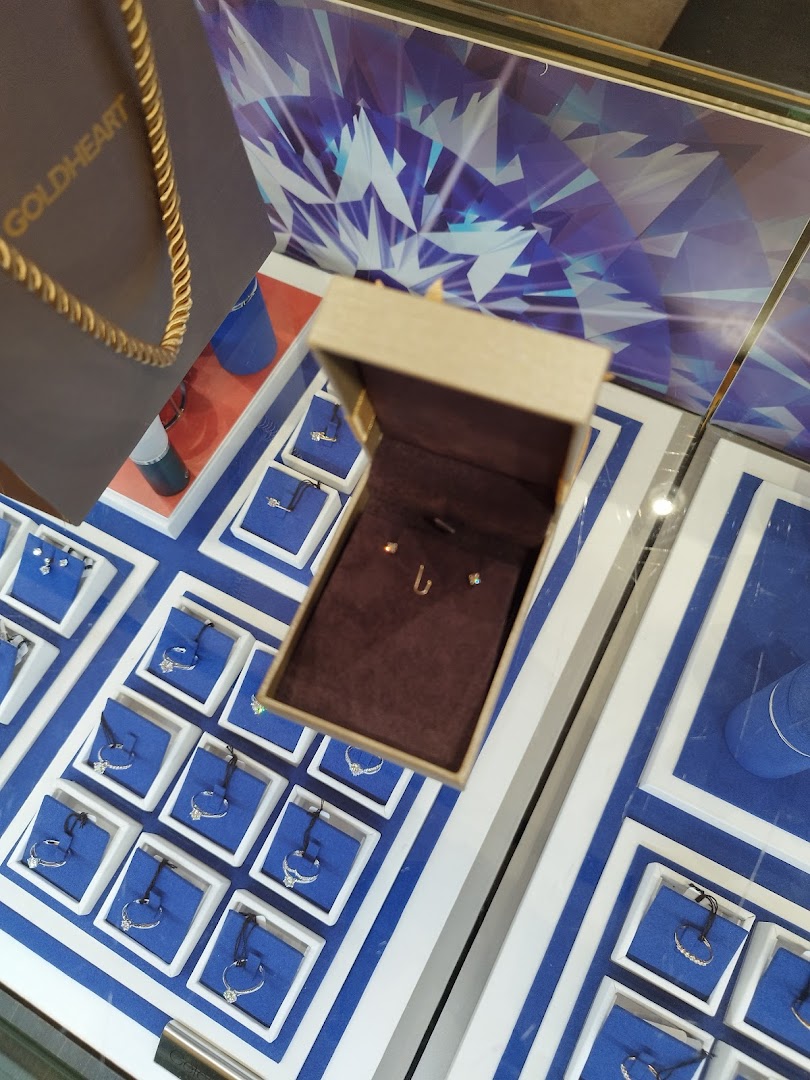 A close-up view of sparkling jewelry displays and an open box with delicate pieces at Goldheart.