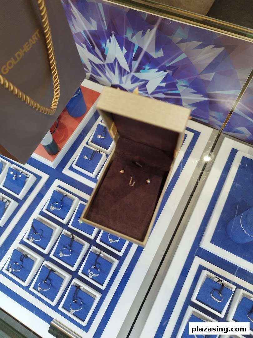 A close-up view of sparkling jewelry displays and an open box with delicate pieces at Goldheart.