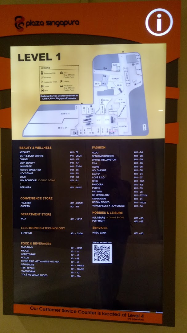 A digital directory board displaying the Level 1 map and store listings at Plaza Singapura.
