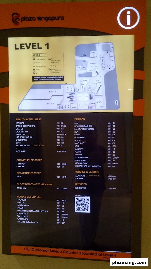 A digital directory board displaying the Level 1 map and store listings at Plaza Singapura.