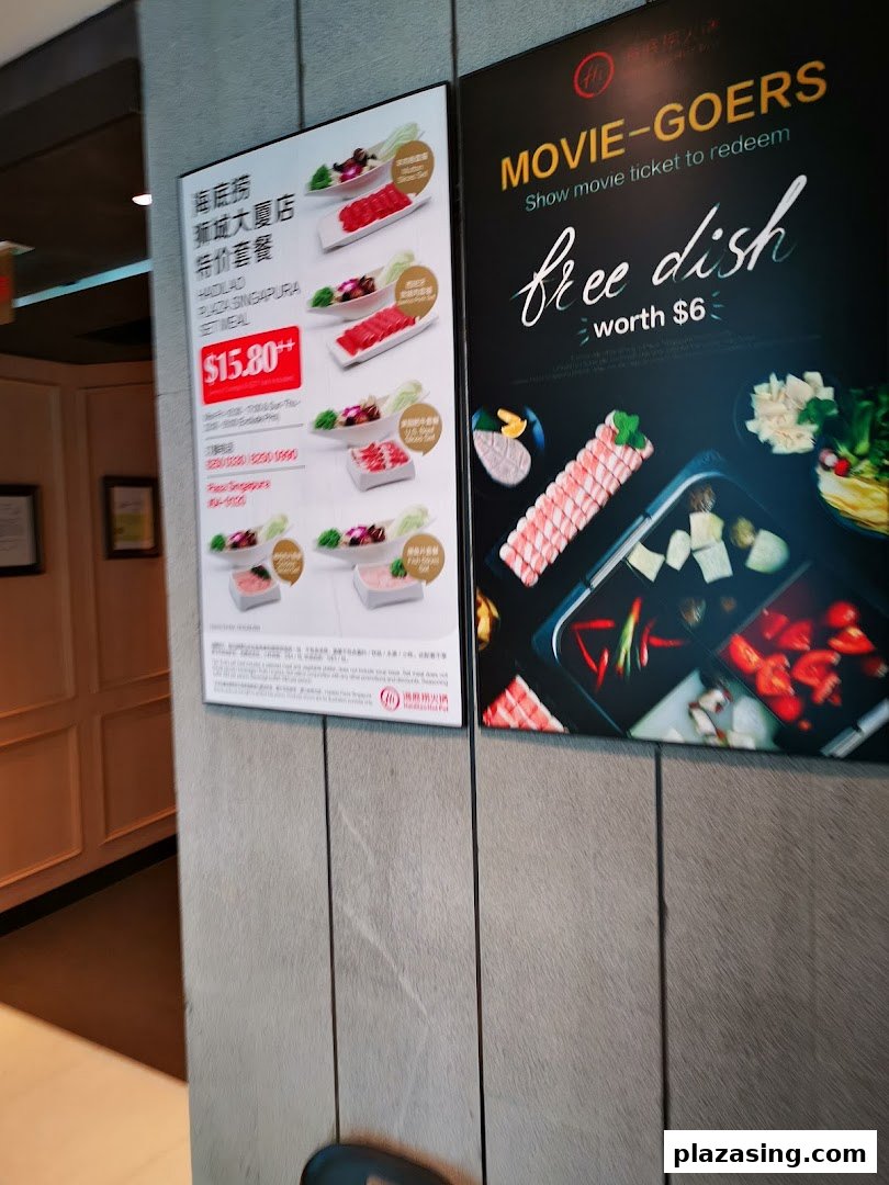Promotional posters at Haidilao Hot Pot featuring a set meal offer and a movie-goer discount.