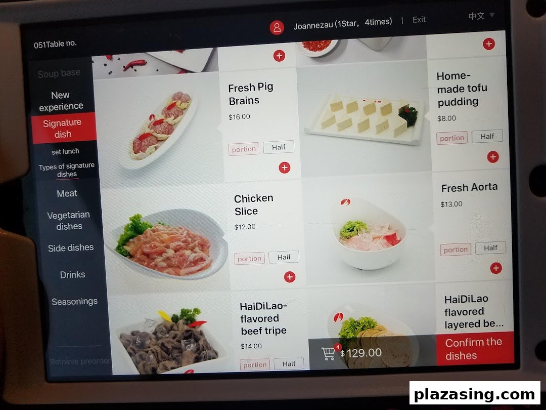 A digital menu screen at Haidilao Hot Pot, displaying various hot pot ingredients and prices.