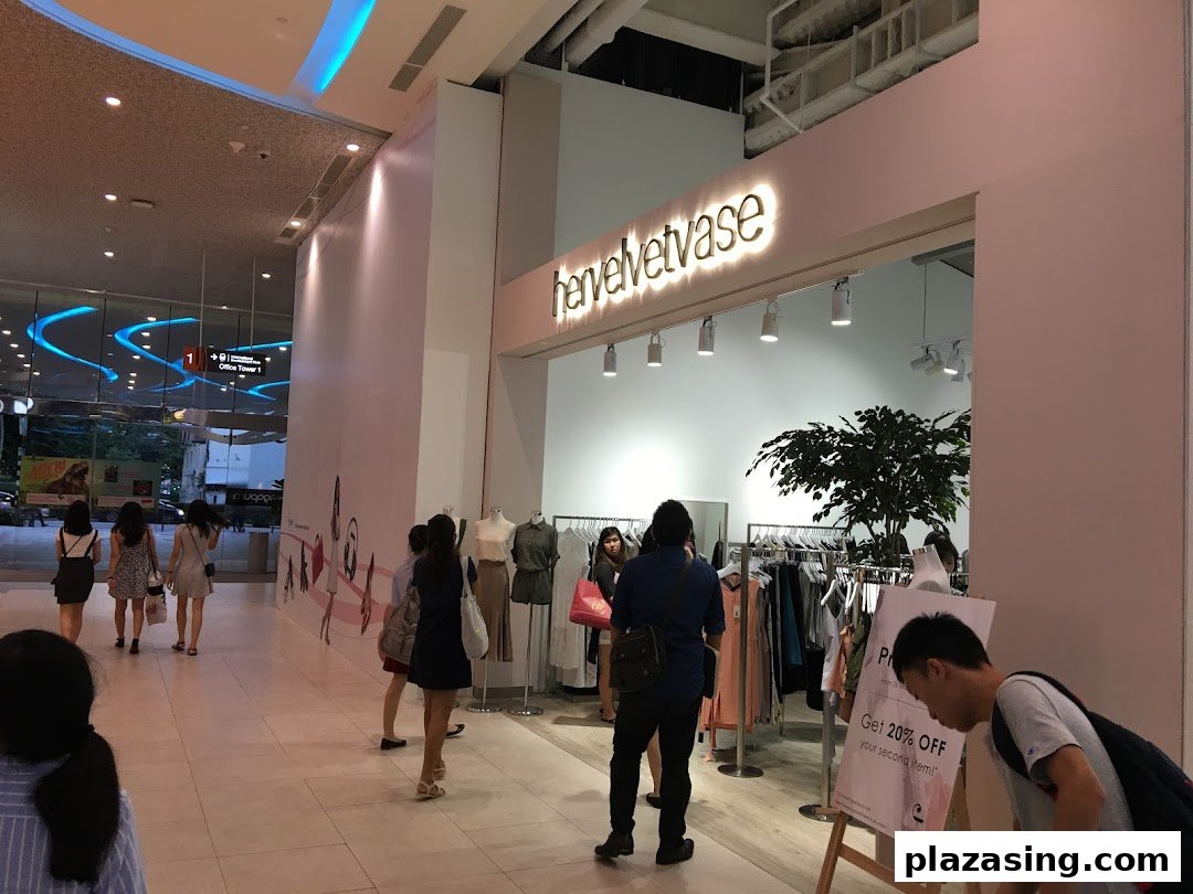 Customers browse stylish apparel and accessories inside the modern hervelvetvase boutique.