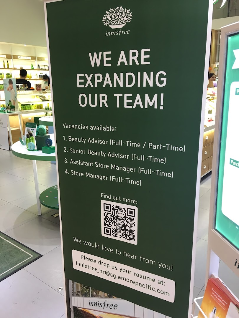 An Innisfree recruitment banner inside the store, listing job vacancies.