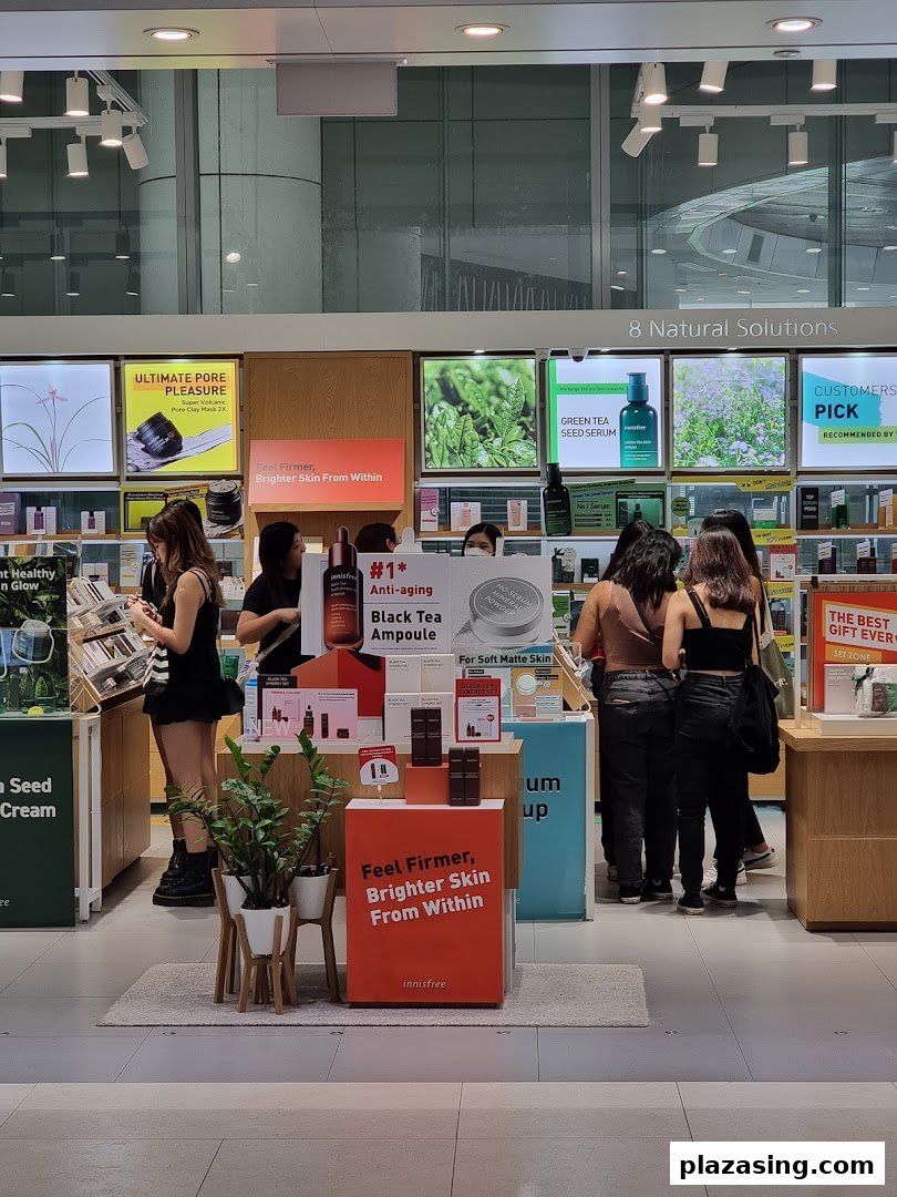 Customers browse natural skincare products and displays inside the Innisfree shop.