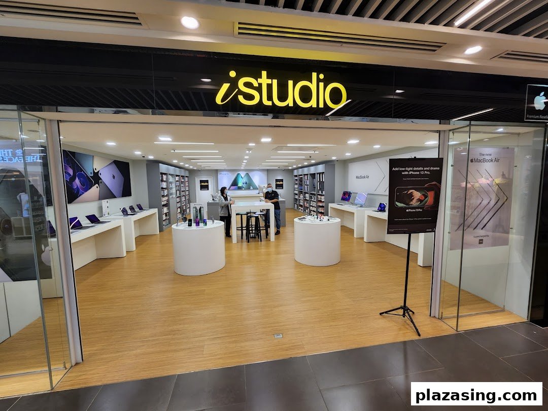 The storefront of iStudio, an Apple Premium Reseller, showcasing various Apple products and a clean interior.