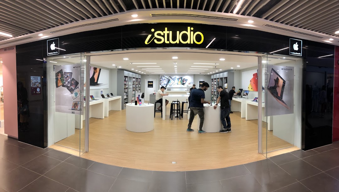 The iStudio shop front at Plaza Singapura, an Apple Premium Reseller, showcasing Apple products.