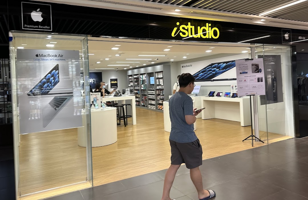 The iStudio shop front at Plaza Singapura, an Apple Premium Reseller, showcasing Apple products.