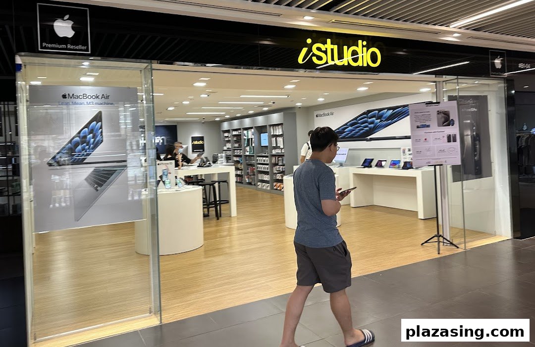 The iStudio shop front at Plaza Singapura, an Apple Premium Reseller, showcasing Apple products.