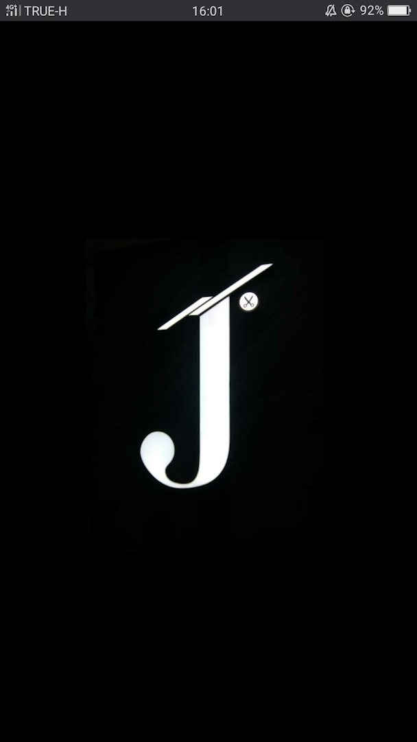 A bright white, stylized 'J' logo with a small scissor icon on a black background.