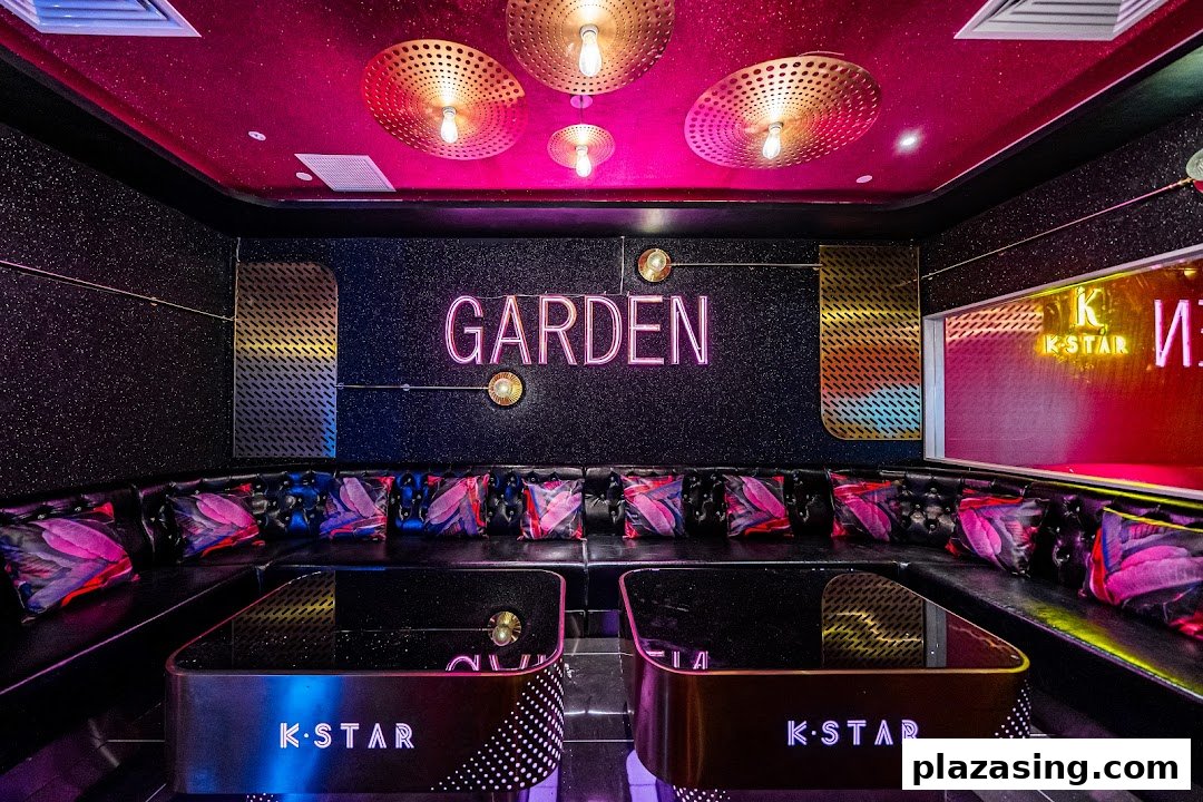 A vibrant KTV room at K.STAR with neon lights, comfortable seating, and modern decor.