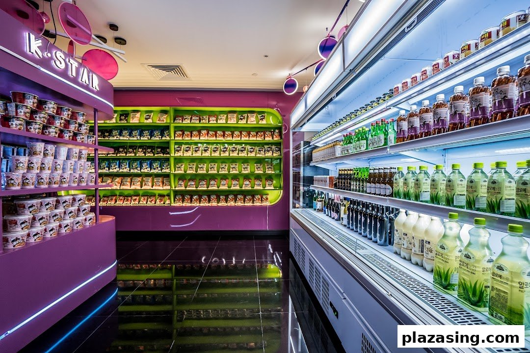 Vibrant interior of K.STAR, showcasing shelves of Korean instant noodles, snacks, and a wide selection of beverages.