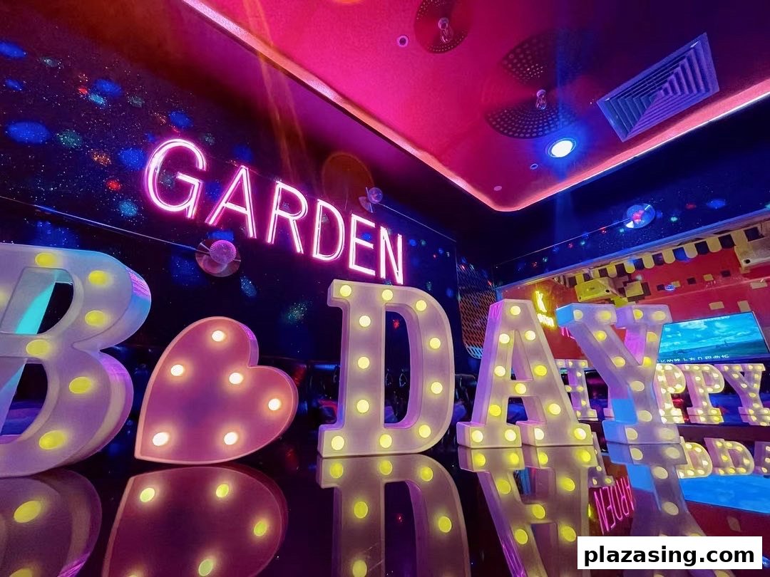 Vibrant KTV room interior with illuminated 'BIRTHDAY' letters and a 'GARDEN' neon sign.