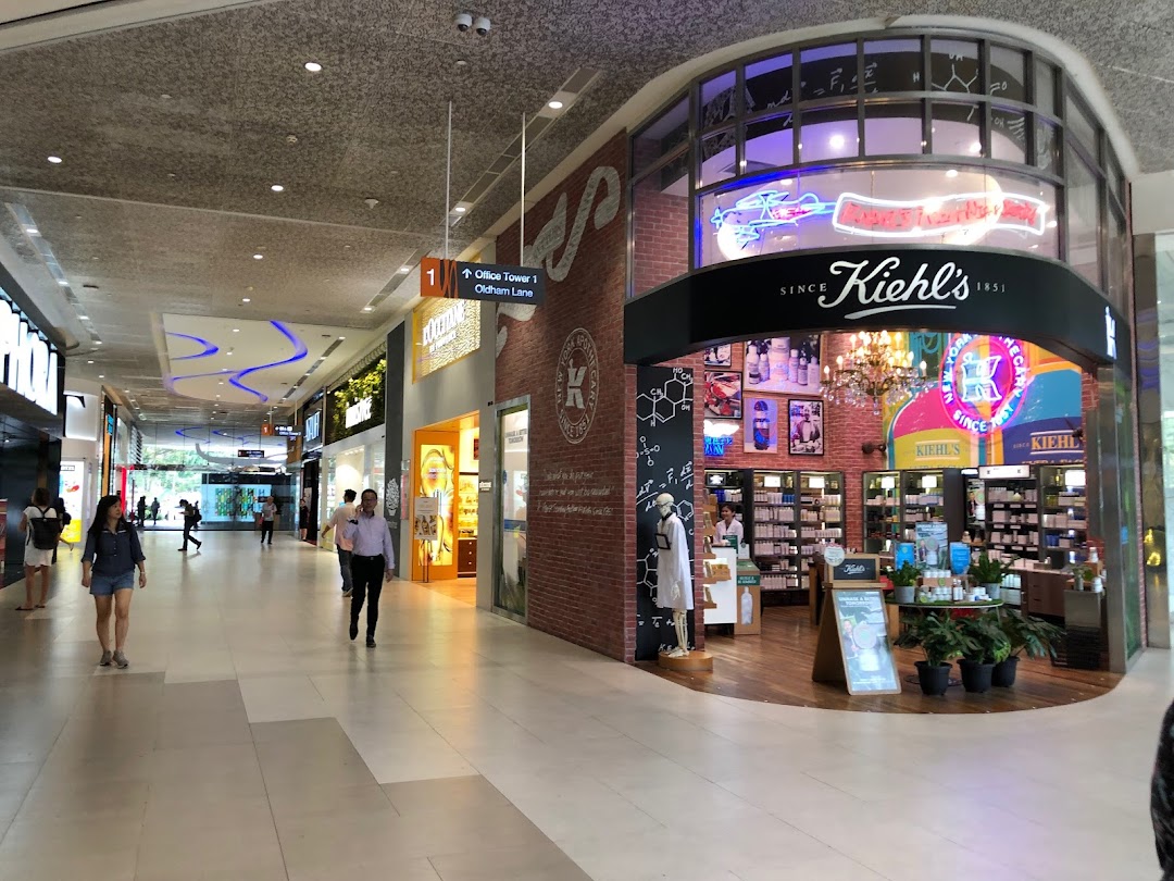 The Kiehl's shop front in Plaza Singapura, showcasing its inviting entrance and product displays.