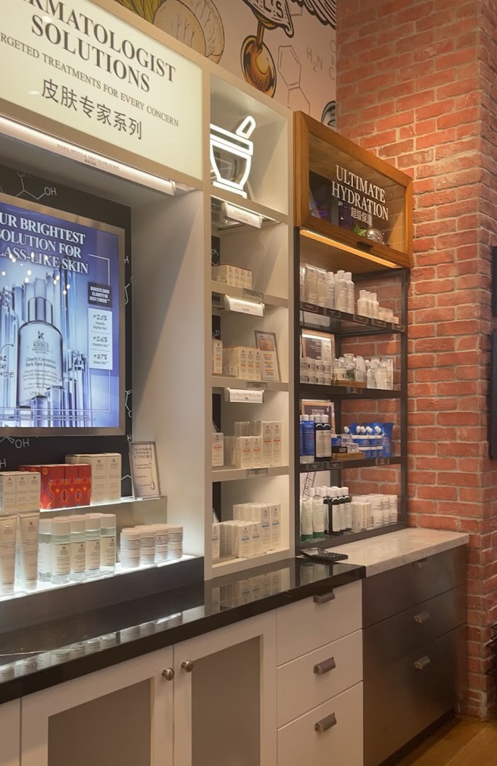 Interior view of Kiehl's skincare display featuring dermatologist solutions, hydration products, and bright skin treatments.