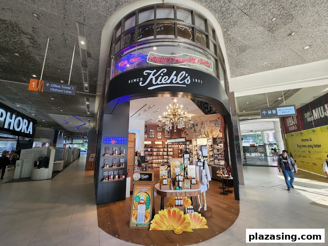The Kiehl's store entrance at Plaza Singapura, showcasing its inviting interior and product displays.