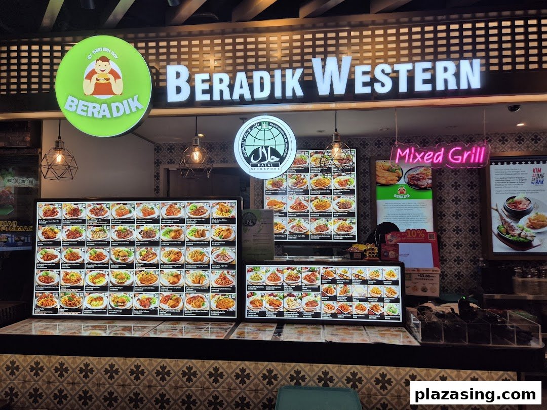 A brightly lit food stall named Beradik Western showcasing numerous menu items on digital displays.