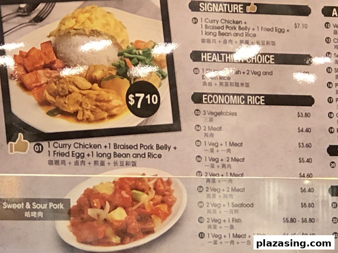 A vibrant menu board displaying various Asian dishes and their prices, including a signature curry chicken set.