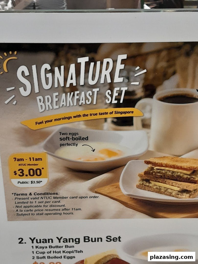 A menu board displaying breakfast sets, including soft-boiled eggs, toast, and coffee, with pricing details.