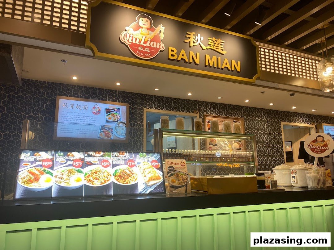 Interior view of Qiu Lian Ban Mian stall, showcasing menu displays and serving counter.