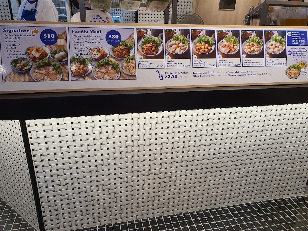 A vibrant menu board showcasing various noodle dishes, soups, and beverages with prices.