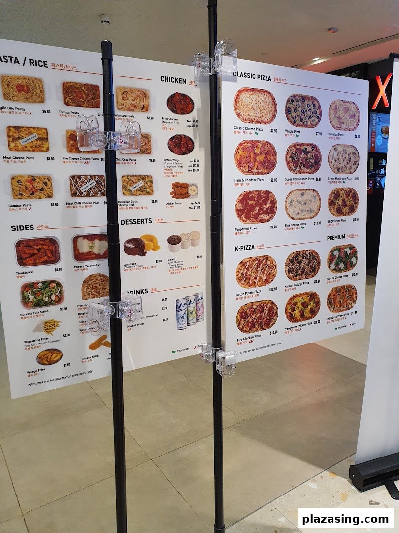 A detailed menu board displaying various pasta, chicken, pizza, sides, desserts, and drinks with prices.